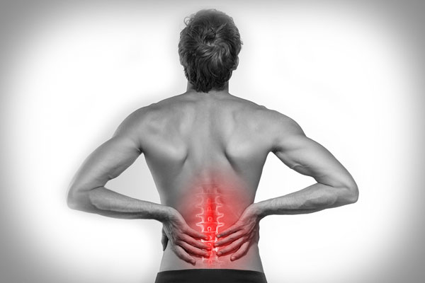 black and white photo of woman with back pain highlighted in red